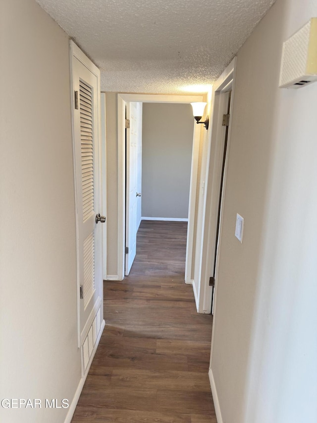 378 Hourglass Dr, El Paso, TX 79915 - hall with wood finished floors and a textured ceiling