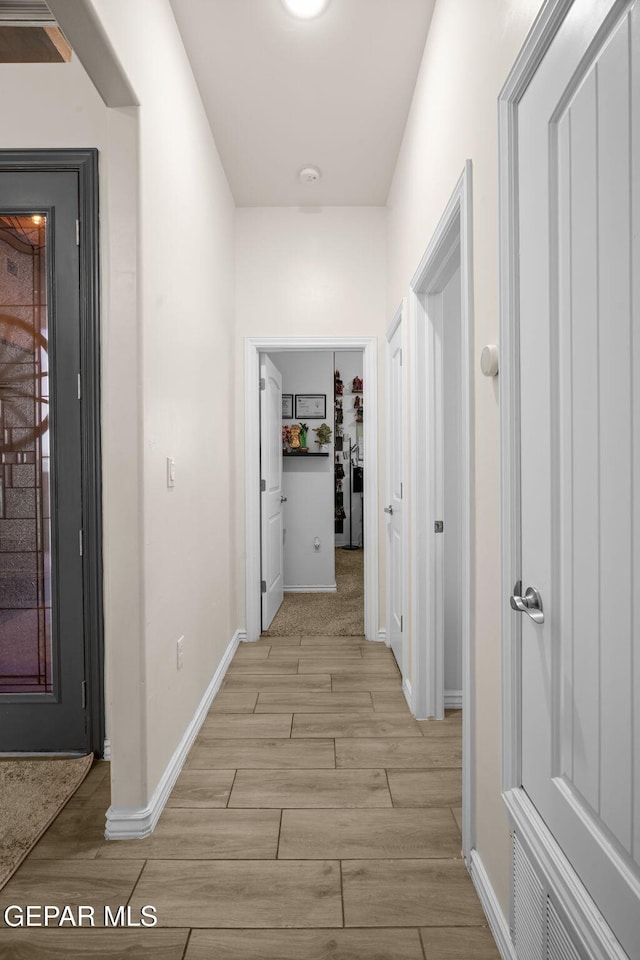 14516 Ciambriello Ave, El Paso, TX 79938 - hallway featuring light wood-type flooring and baseboards