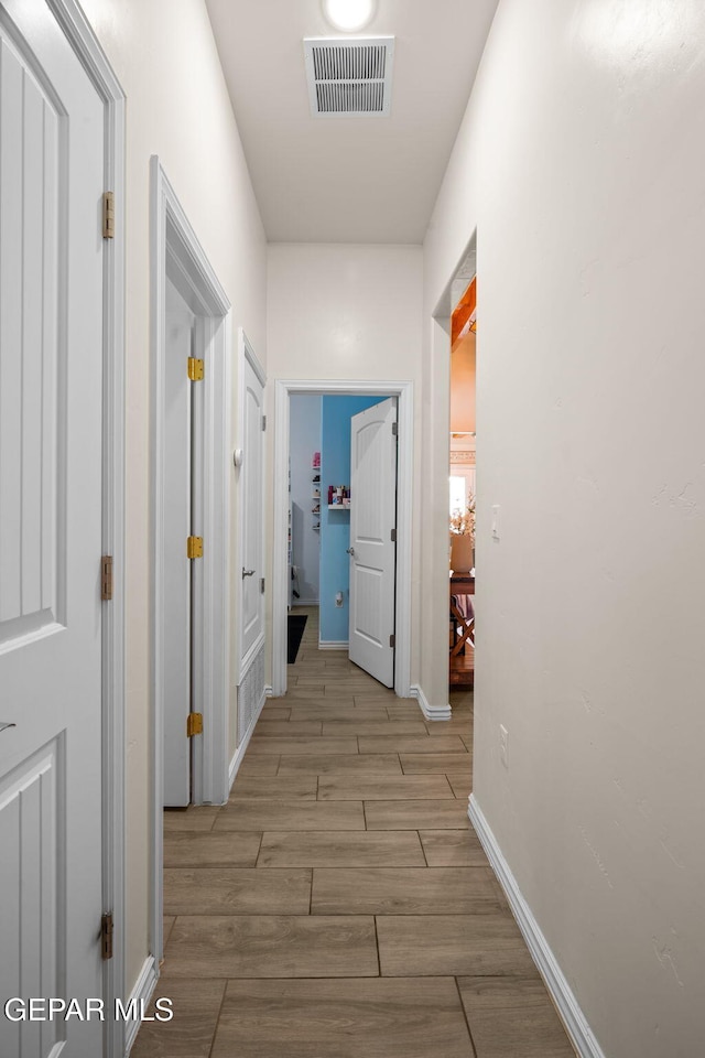 14516 Ciambriello Ave, El Paso, TX 79938 - hall featuring light wood finished floors and baseboards