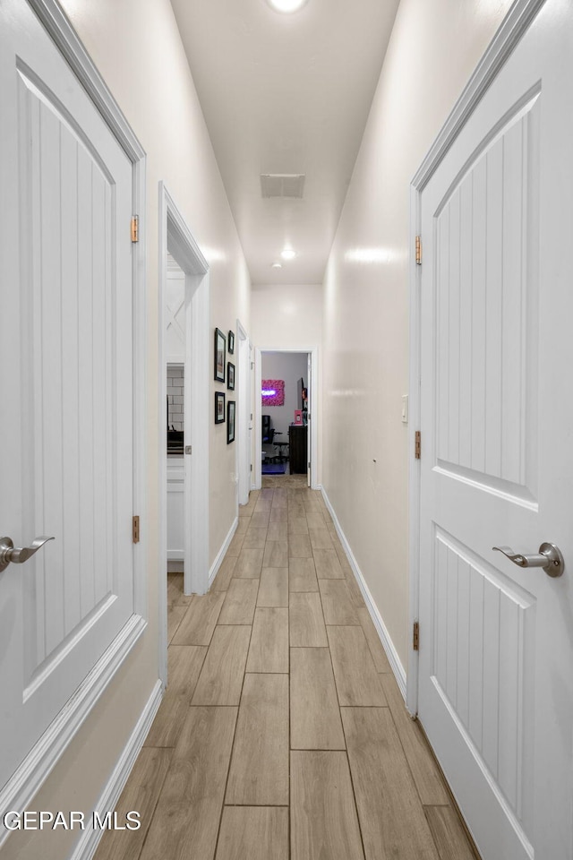14516 Ciambriello Ave, El Paso, TX 79938 - corridor featuring light wood-type flooring and baseboards