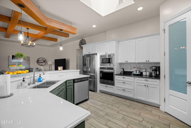 14516 Ciambriello Ave, El Paso, TX 79938 - kitchen with appliances with stainless steel finishes, beam ceiling, white cabinetry, backsplash, and recessed lighting