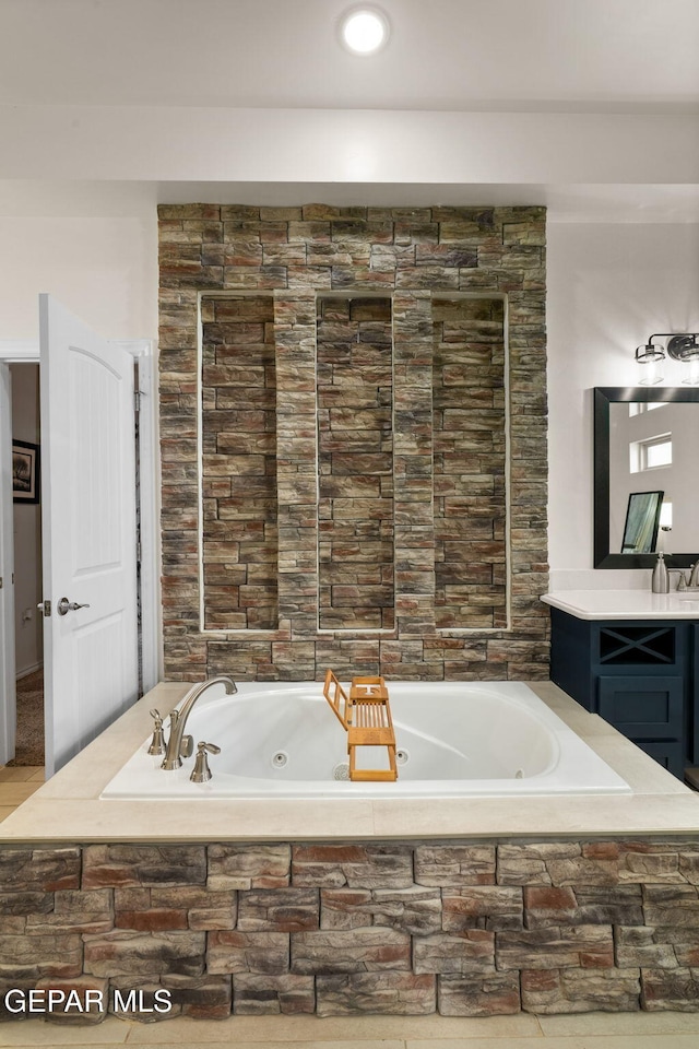 14516 Ciambriello Ave, El Paso, TX 79938 - bathroom with a tub with jets and vanity