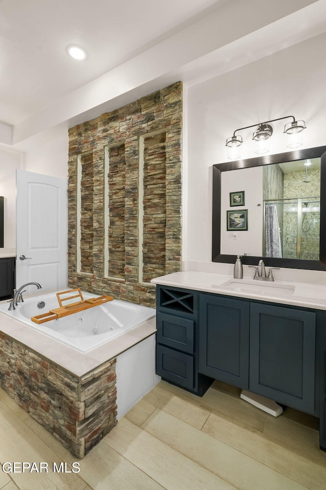 14516 Ciambriello Ave, El Paso, TX 79938 - bathroom featuring a whirlpool tub, vanity, and a shower