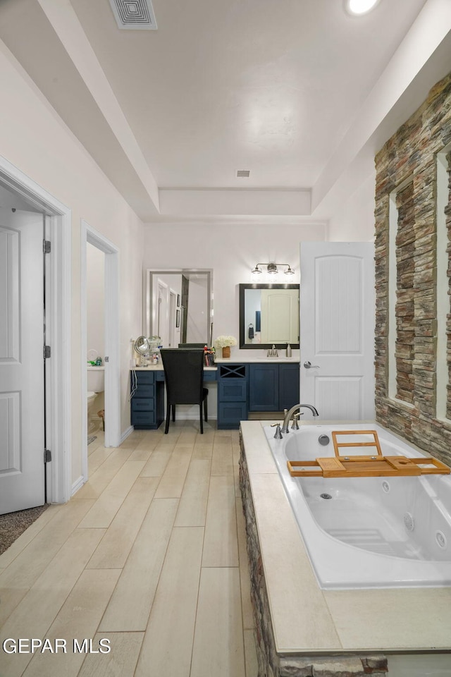 14516 Ciambriello Ave, El Paso, TX 79938 - full bathroom featuring vanity, a whirlpool tub, and a tray ceiling