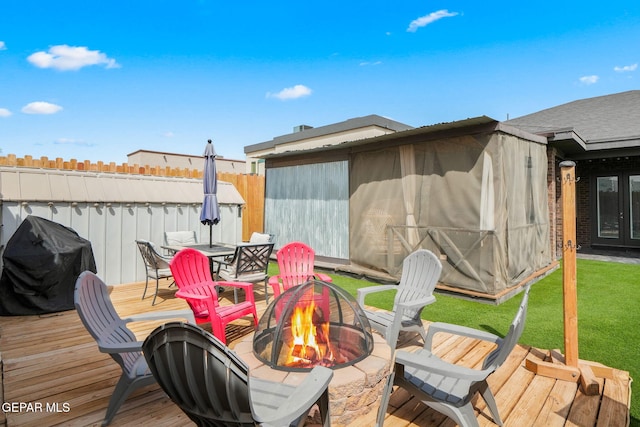 14516 Ciambriello Ave, El Paso, TX 79938 - wooden deck with an outdoor fire pit, french doors, a grill, and outdoor dining area