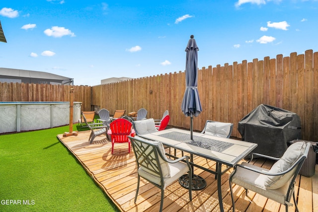 14516 Ciambriello Ave, El Paso, TX 79938 - wooden deck featuring outdoor dining space, a fenced backyard, and area for grilling