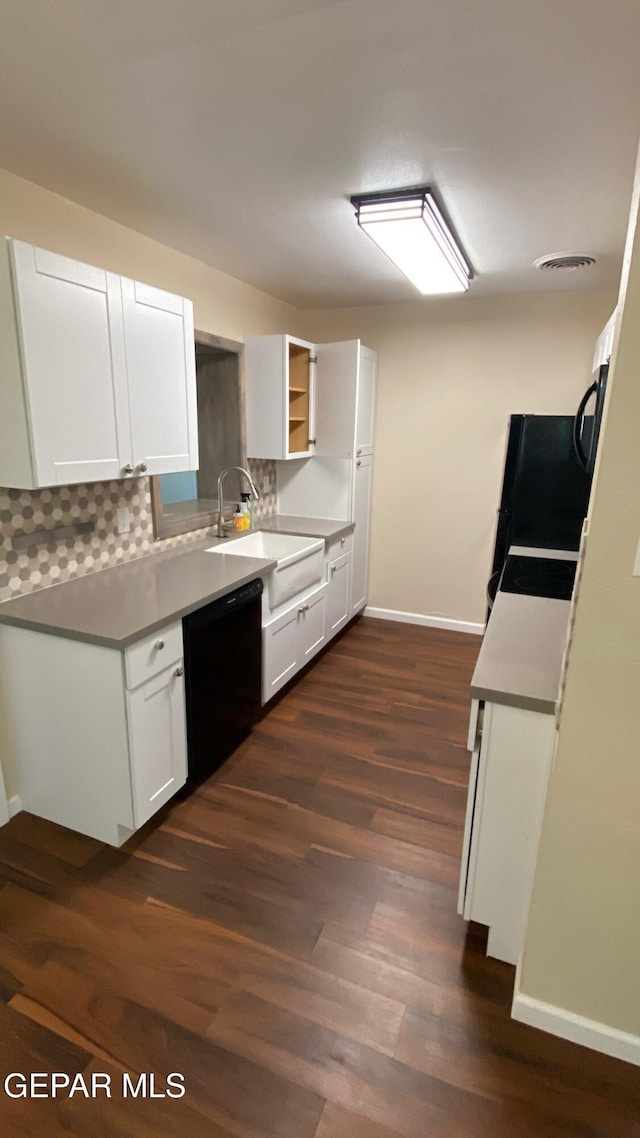 10356 Preston Dr, El Paso, TX 79924 - kitchen featuring dishwasher, dark wood-type flooring, decorative backsplash, white cabinetry, and open shelves