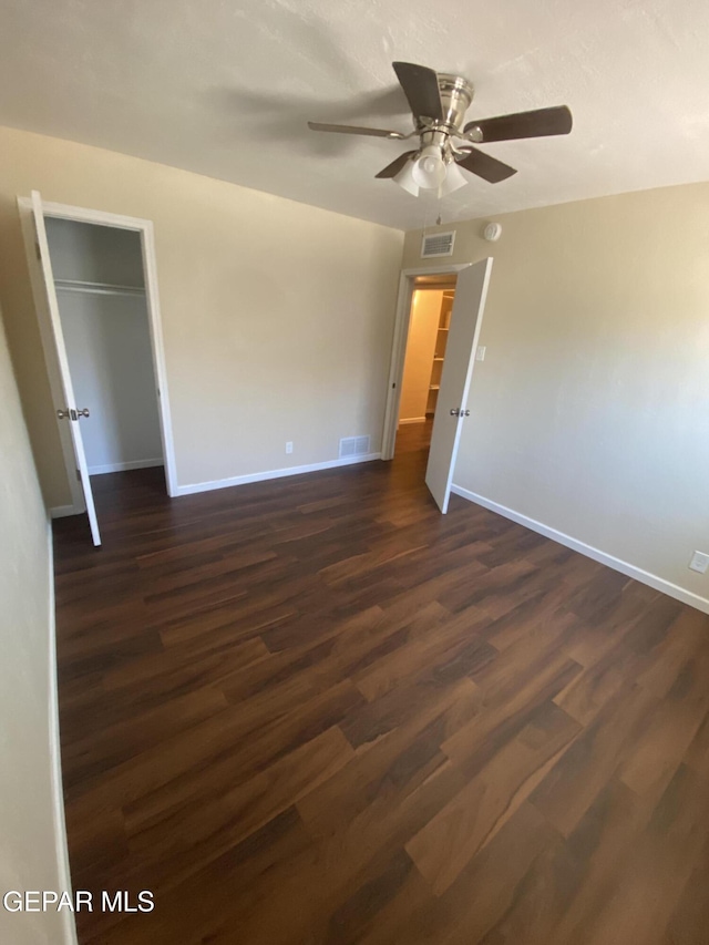10356 Preston Dr, El Paso, TX 79924 - unfurnished bedroom featuring dark wood-style floors, ceiling fan, and a closet