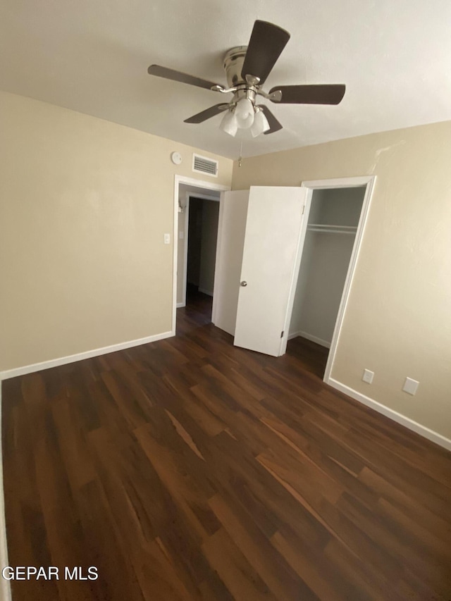 10356 Preston Dr, El Paso, TX 79924 - unfurnished bedroom featuring dark wood finished floors, a ceiling fan, and a closet