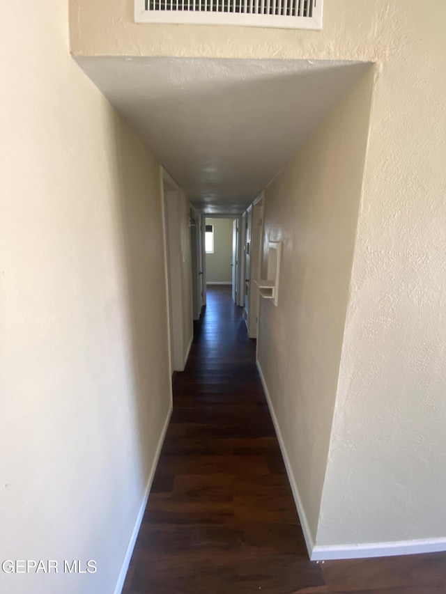 10356 Preston Dr, El Paso, TX 79924 - hallway with dark wood-type flooring and baseboards