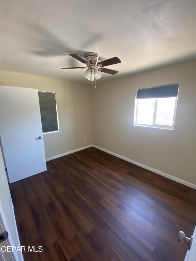 10356 Preston Dr, El Paso, TX 79924 - spare room featuring dark wood finished floors and a ceiling fan