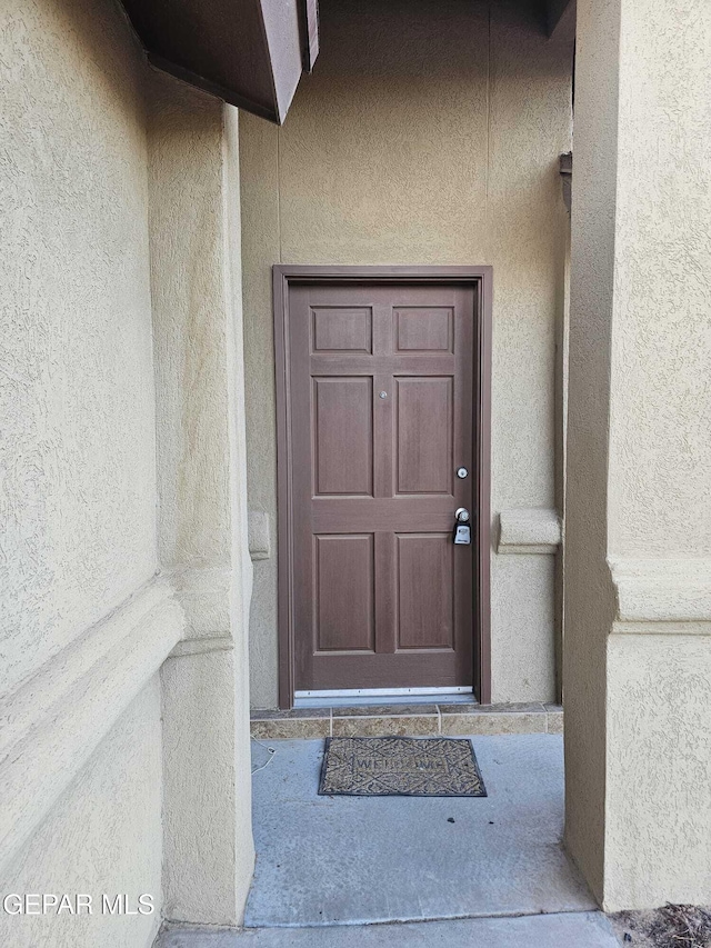 14161 Honey Point Dr, El Paso, TX 79938 - property entrance featuring stucco siding
