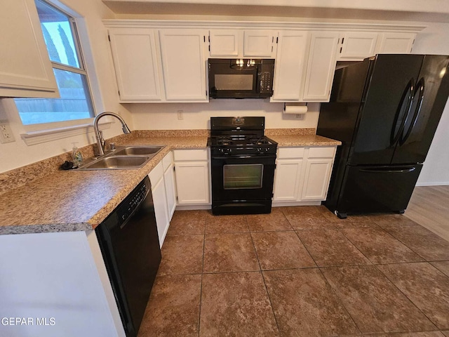 14161 Honey Point Dr, El Paso, TX 79938 - kitchen with black appliances, white cabinetry, and light countertops