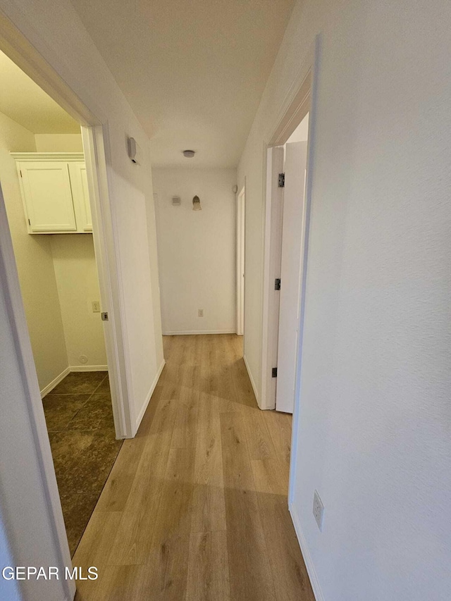 14161 Honey Point Dr, El Paso, TX 79938 - hallway featuring wood finished floors and baseboards