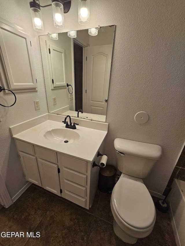 14161 Honey Point Dr, El Paso, TX 79938 - bathroom with vanity, a textured wall, and a bathtub