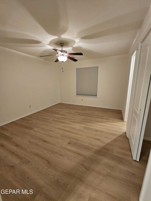 14161 Honey Point Dr, El Paso, TX 79938 - spare room featuring wood finished floors and a ceiling fan