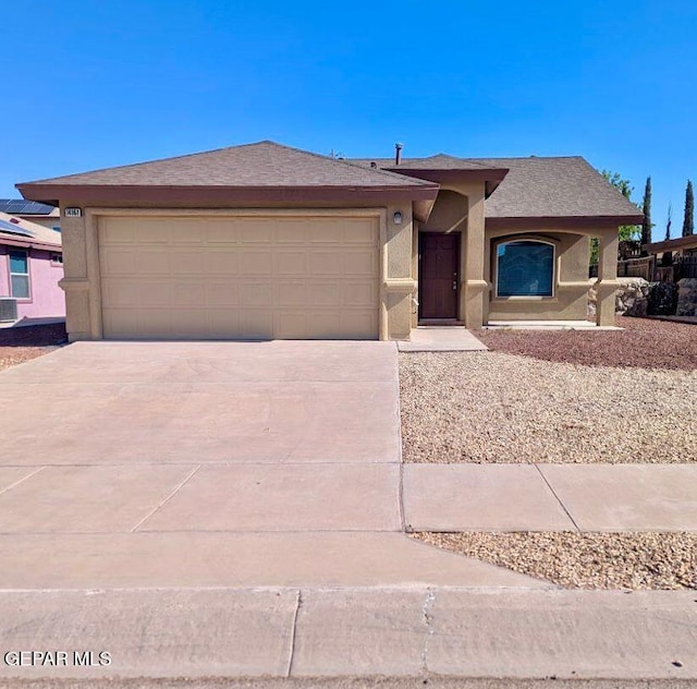 14161 Honey Point Dr, El Paso, TX 79938 - ranch-style house with stucco siding, an attached garage, and concrete driveway