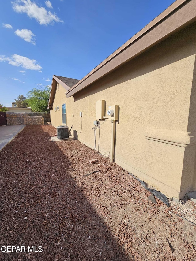 14161 Honey Point Dr, El Paso, TX 79938 - view of home's exterior featuring stucco siding and a central air condition unit