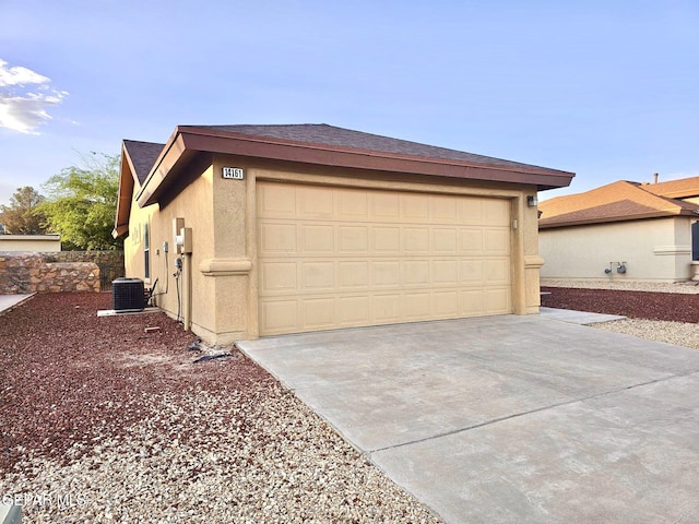 14161 Honey Point Dr, El Paso, TX 79938 - view of side of property with stucco siding, driveway, an attached garage, and an outbuilding