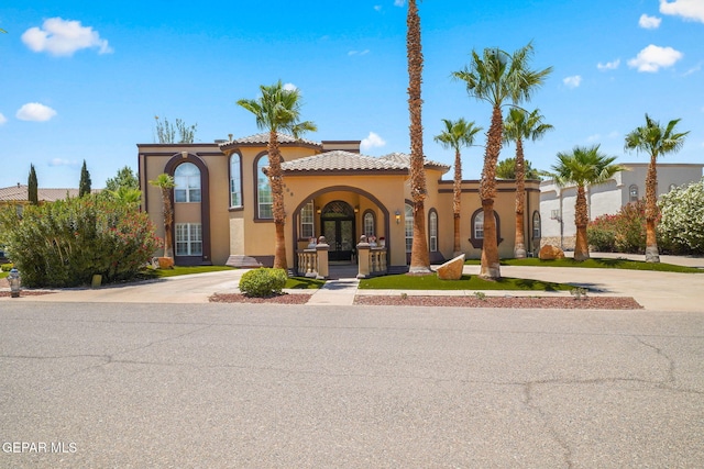 605 Meadow Willow Dr, El Paso, TX 79922 - mediterranean / spanish-style house featuring stucco siding, french doors, curved driveway, and a tile roof