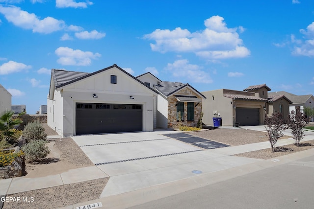 14841 Mike A Mendoza Ave, El Paso, TX 79938 - view of front of property featuring driveway, a garage, board and batten siding, and a tiled roof