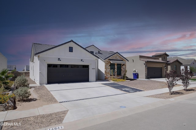 14841 Mike A Mendoza Ave, El Paso, TX 79938 - modern inspired farmhouse with concrete driveway, an attached garage, board and batten siding, and a tiled roof