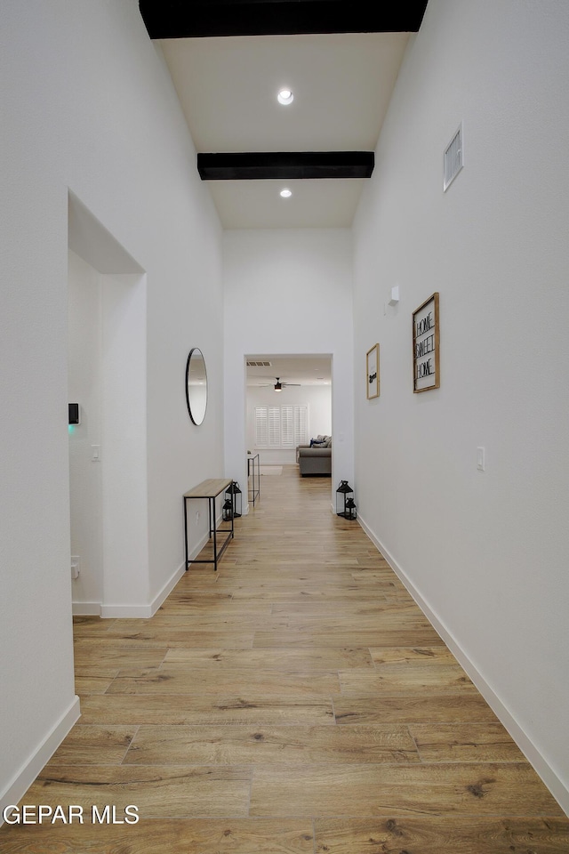 14841 Mike A Mendoza Ave, El Paso, TX 79938 - corridor with beam ceiling, wood finished floors, recessed lighting, and a high ceiling