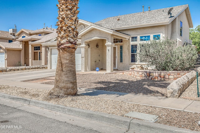10937 Acoma St, El Paso, TX 79934 - view of front facade featuring a garage, stucco siding, concrete driveway, and roof with shingles