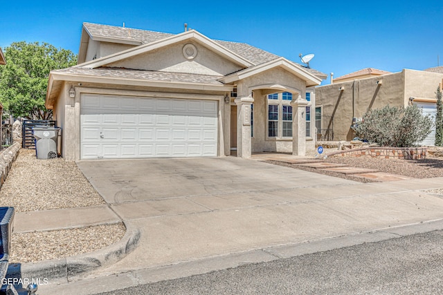 10937 Acoma St, El Paso, TX 79934 - view of front of home featuring stucco siding, concrete driveway, and a garage