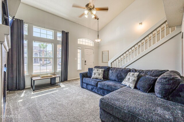 10937 Acoma St, El Paso, TX 79934 - living area featuring stairs, carpet flooring, plenty of natural light, and a high ceiling