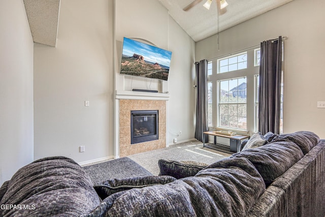 10937 Acoma St, El Paso, TX 79934 - carpeted living room with high vaulted ceiling, a ceiling fan, and a fireplace