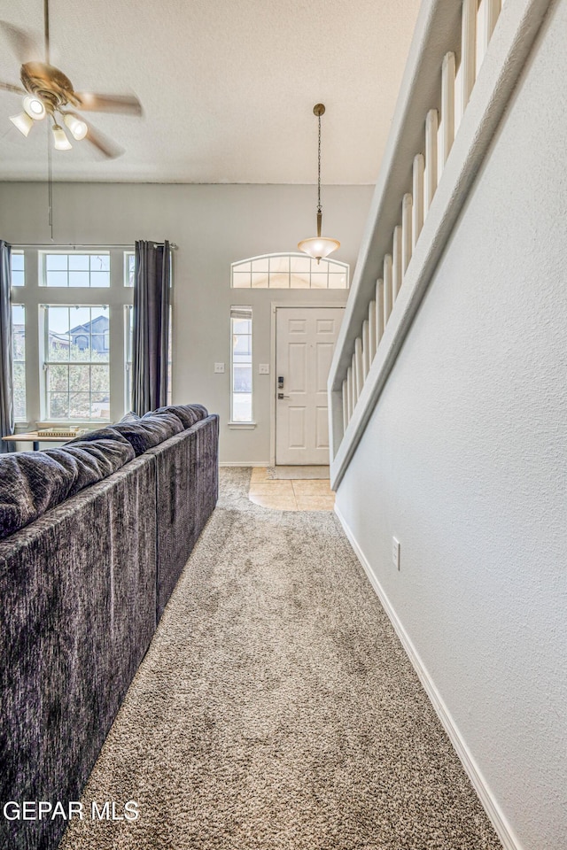 10937 Acoma St, El Paso, TX 79934 - carpeted foyer entrance with healthy amount of natural light, a ceiling fan, and stairs