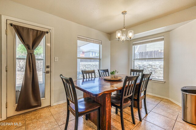 10937 Acoma St, El Paso, TX 79934 - dining room featuring a chandelier and light tile patterned floors