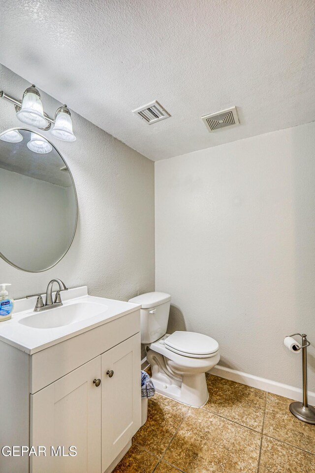 10937 Acoma St, El Paso, TX 79934 - bathroom with vanity, a textured ceiling, and tile patterned flooring