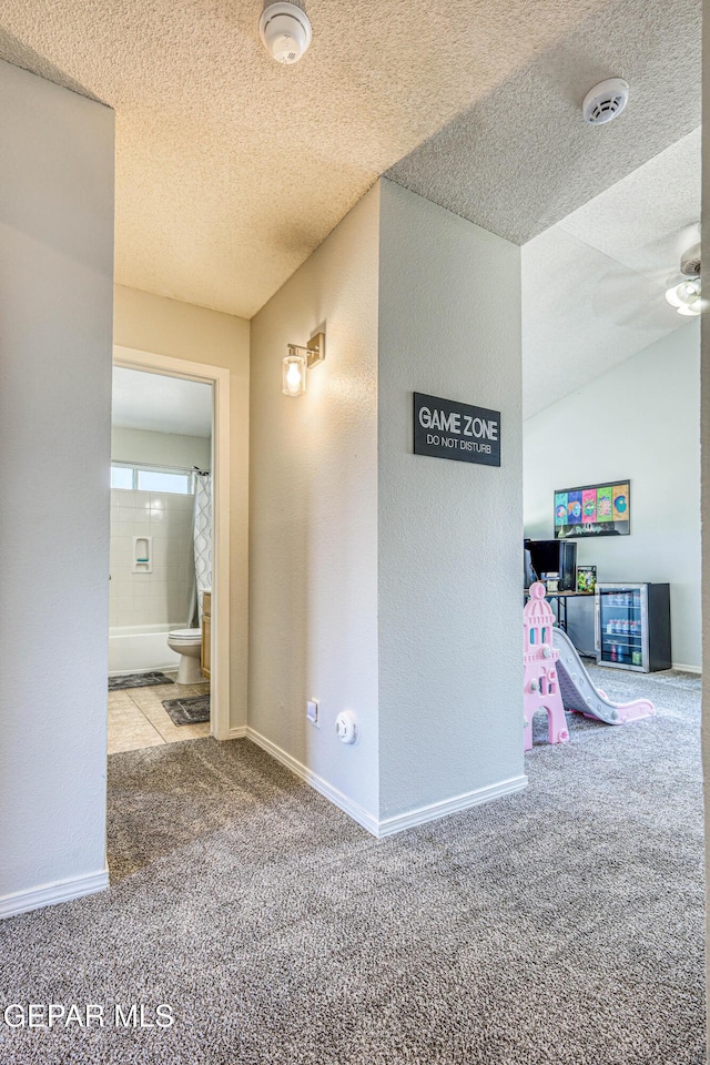 10937 Acoma St, El Paso, TX 79934 - hallway featuring carpet flooring and a textured ceiling