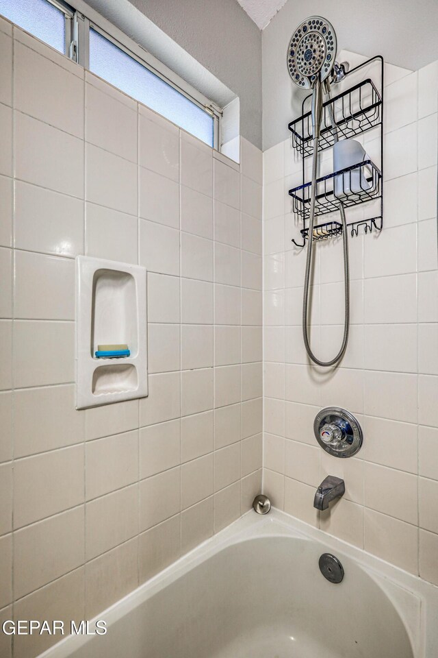 10937 Acoma St, El Paso, TX 79934 - full bath featuring plenty of natural light and shower / washtub combination