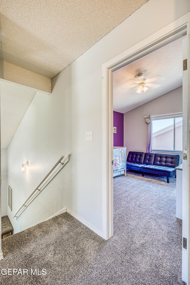 10937 Acoma St, El Paso, TX 79934 - hall featuring carpet, a textured ceiling, and an upstairs landing