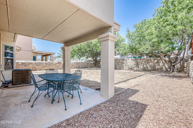 10937 Acoma St, El Paso, TX 79934 - fenced backyard with a patio area and outdoor dining area