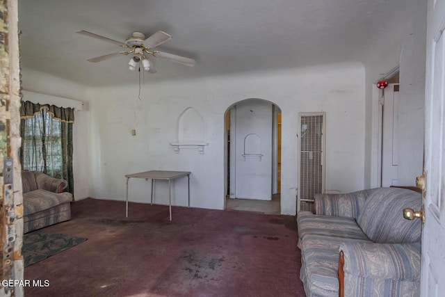 7113 Dale Rd, El Paso, TX 79915 - carpeted living area featuring a heating unit, a ceiling fan, and arched walkways