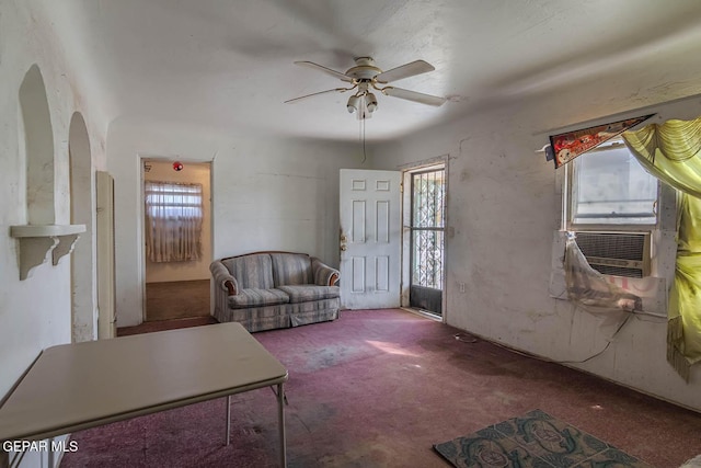 7113 Dale Rd, El Paso, TX 79915 - carpeted living room featuring a ceiling fan, arched walkways, and cooling unit