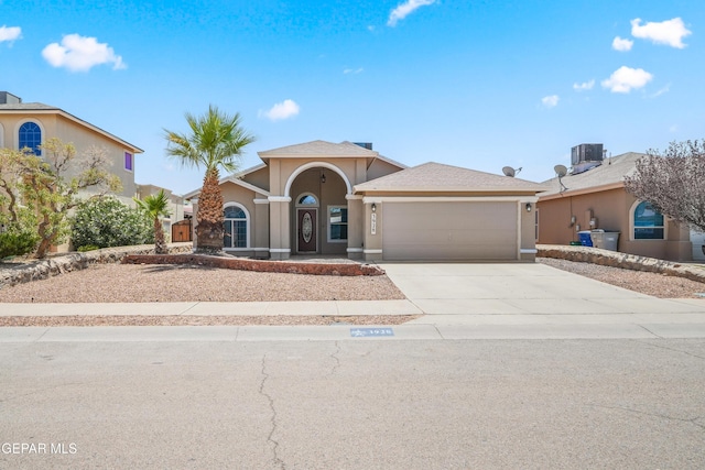 3928 Tierra Roman Dr, El Paso, TX 79938 - mediterranean / spanish-style home with a garage, driveway, and stucco siding