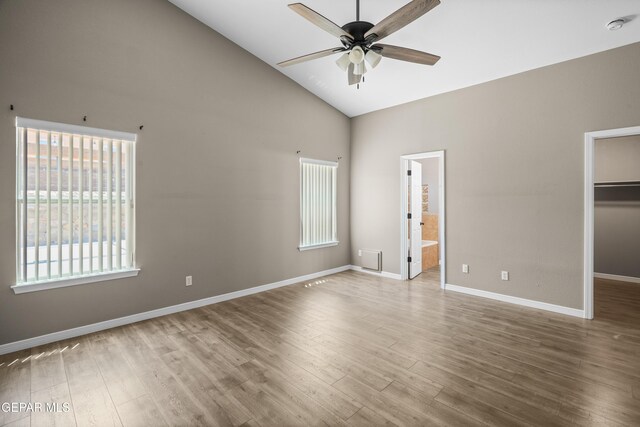 3928 Tierra Roman Dr, El Paso, TX 79938 - unfurnished bedroom with high vaulted ceiling, wood finished floors, a walk in closet, ensuite bath, and a closet