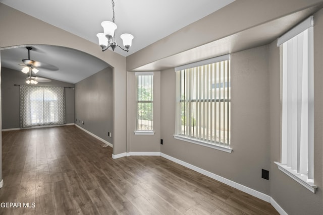 3928 Tierra Roman Dr, El Paso, TX 79938 - spare room with a chandelier, healthy amount of natural light, wood finished floors, arched walkways, and lofted ceiling