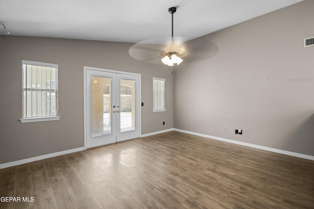 3928 Tierra Roman Dr, El Paso, TX 79938 - empty room with plenty of natural light, french doors, and wood finished floors