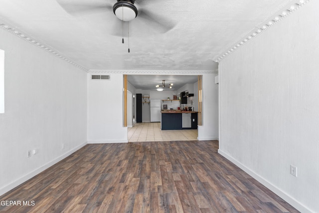 5656 Dailey Ave, El Paso, TX 79905 - unfurnished living room featuring ceiling fan and light wood finished floors