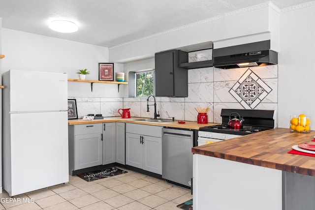 5656 Dailey Ave, El Paso, TX 79905 - kitchen featuring freestanding refrigerator, wood counters, dishwasher, and open shelves