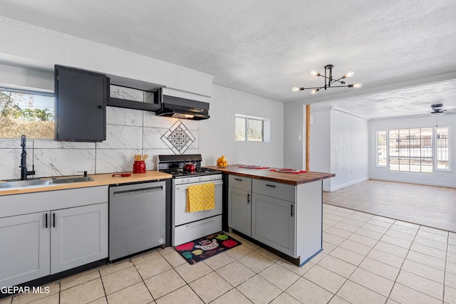 5656 Dailey Ave, El Paso, TX 79905 - kitchen featuring dishwasher, gas range gas stove, exhaust hood, wood counters, and healthy amount of natural light