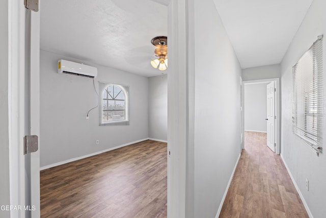 5656 Dailey Ave, El Paso, TX 79905 - hall with wood finished floors and an AC wall unit