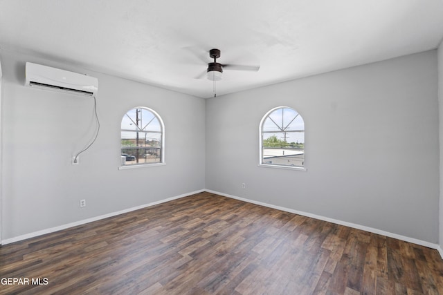 5656 Dailey Ave, El Paso, TX 79905 - spare room featuring a wall unit AC, plenty of natural light, ceiling fan, and wood finished floors