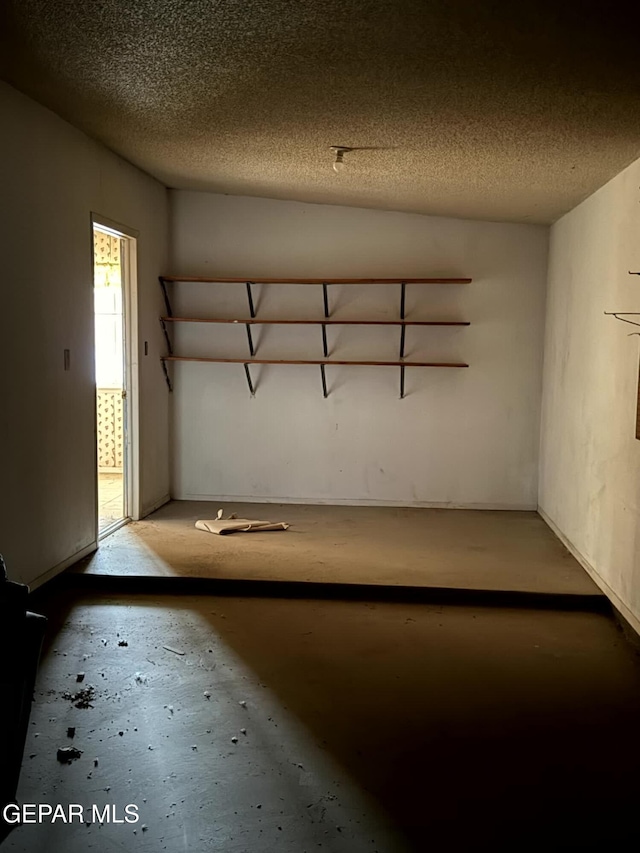 9212 Atun Way, El Paso, TX 79907 - basement with a textured ceiling